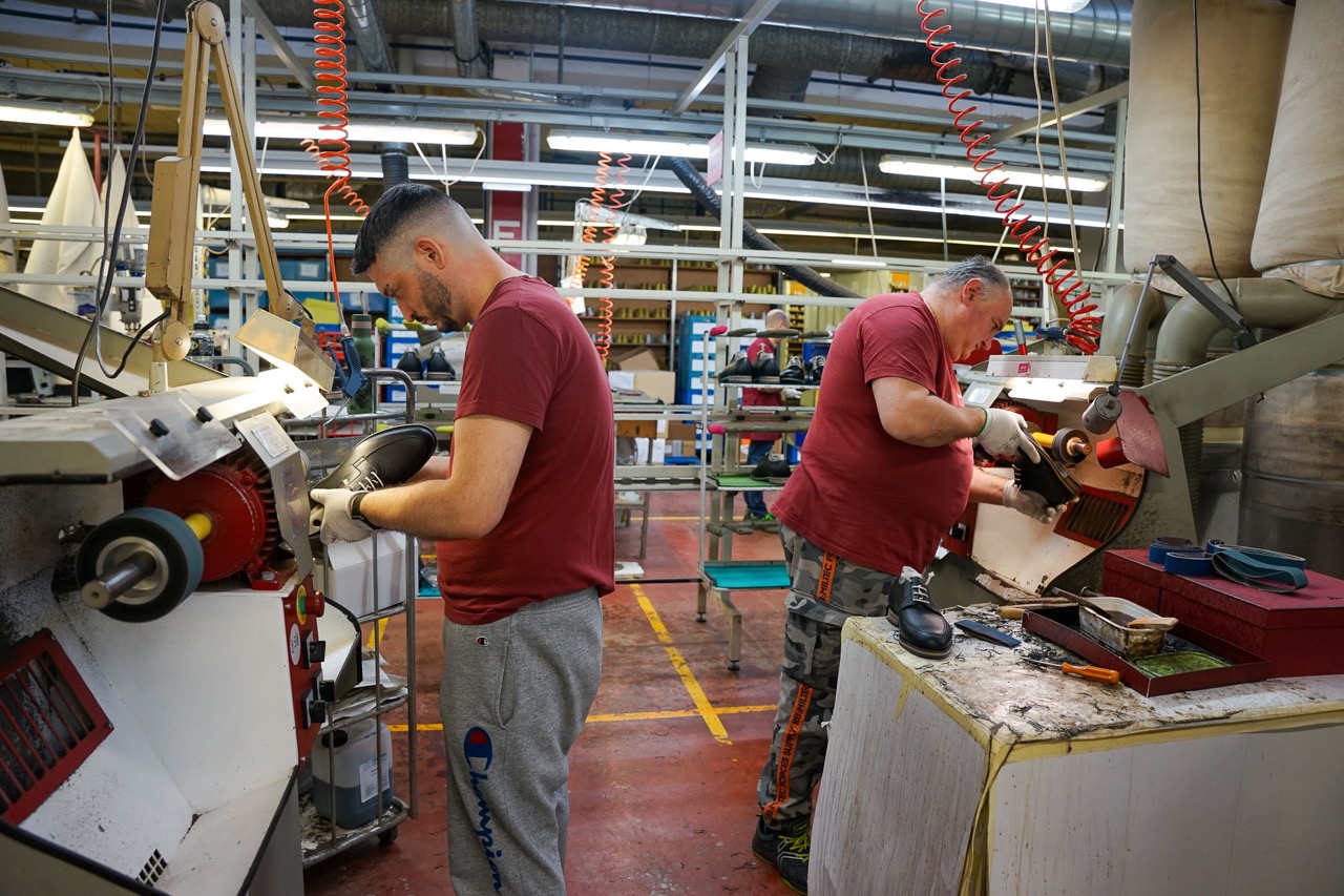 Bally's factory visit - two men working